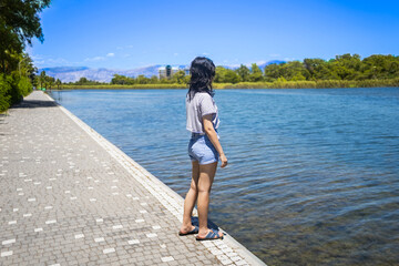 Young teen girl on the shore of Titreyen Gol lake in Turkey © Anna