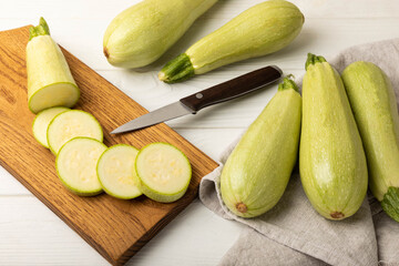 Slices of zucchini.Squash vegetable marrow zucchini on white texture background.Vegetarian organic vegetables.Healthy food.Copy space.Place for text.Healthy food concept.