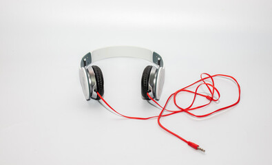 white headphone and red cable isolate on white background.