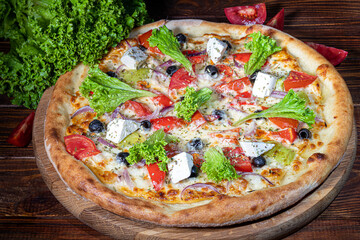 Pizza with bacon and cheese, herbs and cherry tomatoes. With mozzarella, shrimp and octopus,...