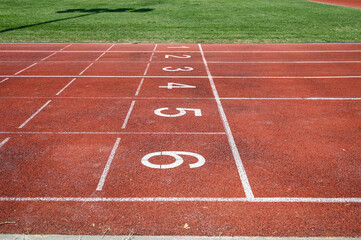 Running track numbers. Red running track with lanes and numbers. Starting positions for running at stadium.