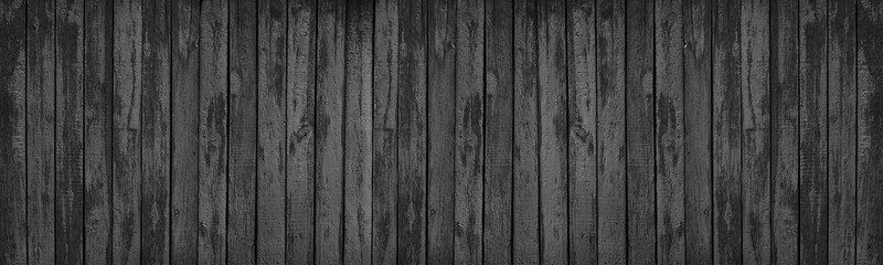 Black painted old rough wood board grunge texture. Dark gloomy wooden background