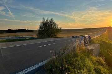 asphalt road and sunset