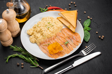Scramble egg with salmon and cheese sandwich on wooden background