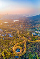 Aerial photography of Meiling Palace Scenic Spot in Nanjing City, Jiangsu Province, China in autumn and the Nanjing urban building complex in the distance