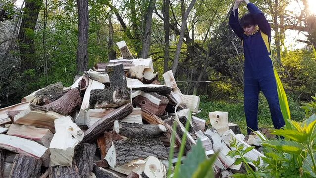 A man chops wood, a woodchopper