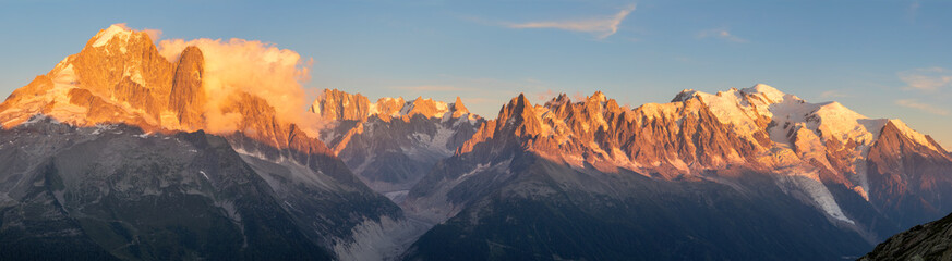 Fototapeta na wymiar The panorama of Mont Blanc massif Les Aiguilles towers, Grand Jorasses and Aiguille du Verte in the sunset light.