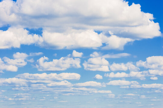 Clouds in the blue sky. Clouds are white-winged horses. Background. Background image.