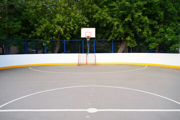 Outdoor basketball hoop on an urban outdoor playground.