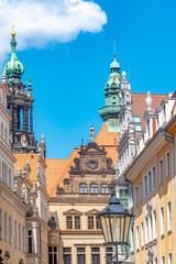 Cityscape of beautiful old Dresden. Historical, touristic and shopping center in downtown of Dresden, illuminated street, Germany, at sunny day.