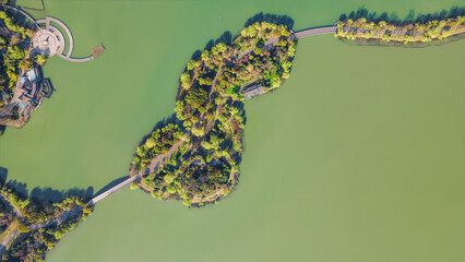 Aerial photography of Bogong Island Ecological Park, Yuantouzhu Scenic Area and the city center building complex in Wuxi City, Jiangsu Province, China