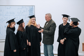The rector of the university, a professor of mathematics, personally congratulates each of the...