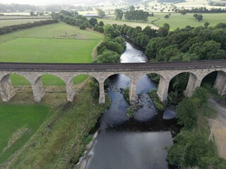 Fototapeta na wymiar Arthington Victorian railway Viaduct, also known as Castley Viaduct or Wharfedale Viaduct, railway bridge crossing the Wharfe valley. Arthington in West Yorkshire