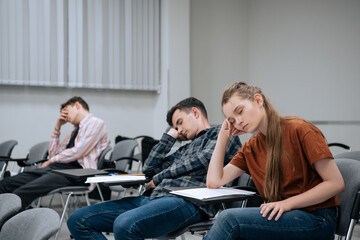 A break between classes in high school. Students rest and sleep in the classroom because of the large number of lessons and overwork