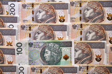 polskie banknoty 200 złotowe i jeden banknot 100 złotowy  - obrazy, fototapety, plakaty