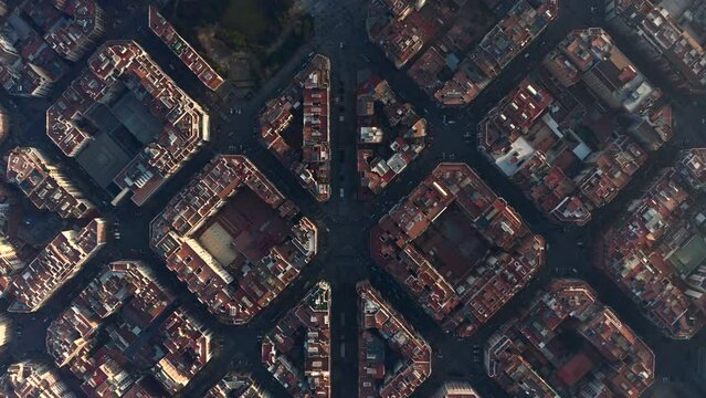 Birds eye shot of square blocks of buildings in urban borough. Avinguda Gaudi passing through middle of shot. Barcelona, Spain