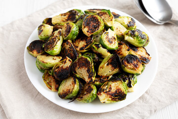 Homemade Roasted Brussel Sprouts on a Plate, side view.