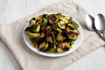 Homemade Roasted Brussel Sprouts on a Plate, side view.