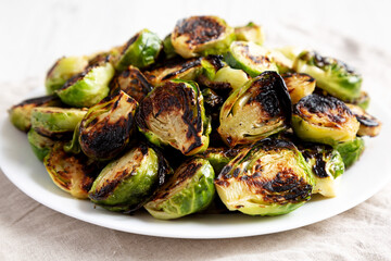 Homemade Roasted Brussel Sprouts on a Plate, side view.