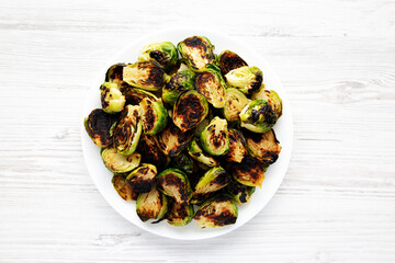 Homemade Roasted Brussel Sprouts on a Plate, top view. Flat lay, overhead, from above.