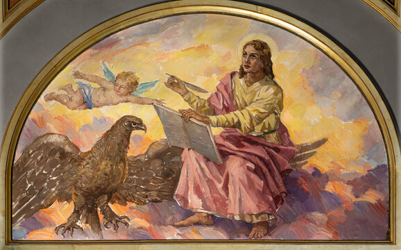VALENCIA, SPAIN - FEBRUARY 17, 2022: The painting St. john the Evangelist in church Iglesia El Buen Pastor by Miguel Vaguer (1959).