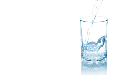 Mineral water pouring into glass isolated on white background.