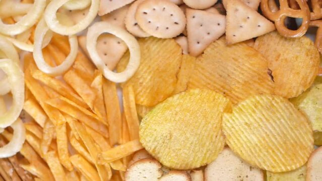 Many types of salty snacks: chips, crackers