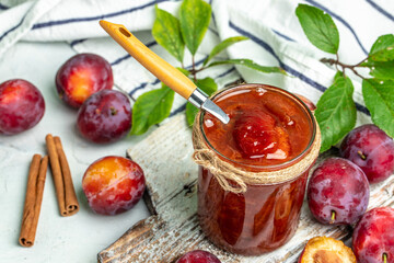Sweet homemade plum jam on a light background. place for text, top view