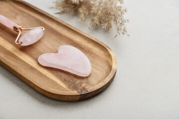Facial rose quartz stone massage roller and gua sha massager