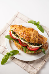 Crispy croissant with mozzarella cheese and pesto sauce