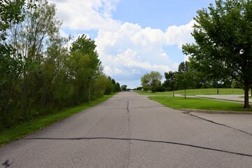 The long street in the country on a sunny day.