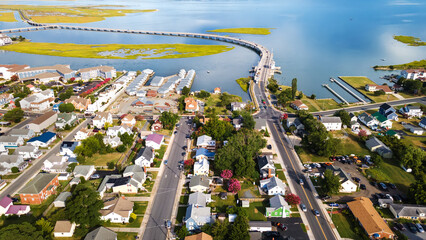 Chincoteague Island, residential areas and marinas, houses and motels with car parks. bridge and...
