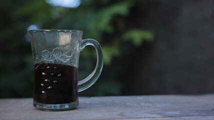 a cup of black coffee in the garden in the afternoon