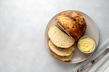 Soda bread, traditional fast, homemade irish bread with butter, top view, copy space