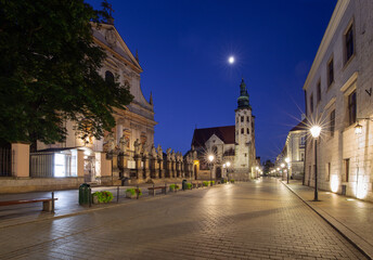 Fototapeta na wymiar Krakow. Old houses in night illumination at dawn.