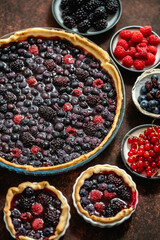 Homemade fresh round cake tart with berries, raspberries, blackberries