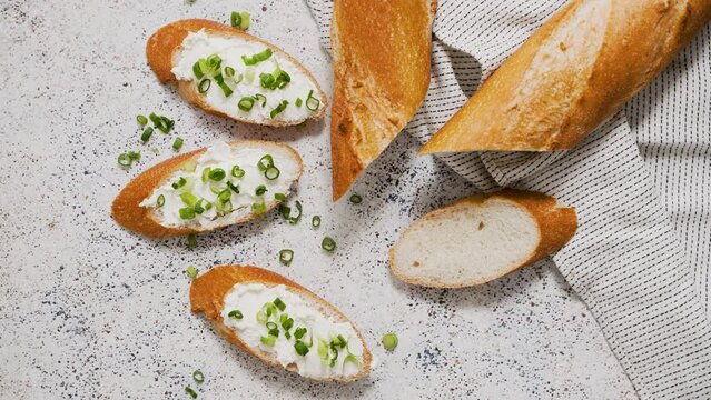 Fresh and delicious crispy baguette with cream cheese and chives
