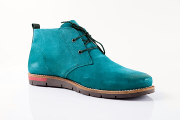 Male cyan leather boot on white background, isolated product. Differentiated footwear and exclusive design.
