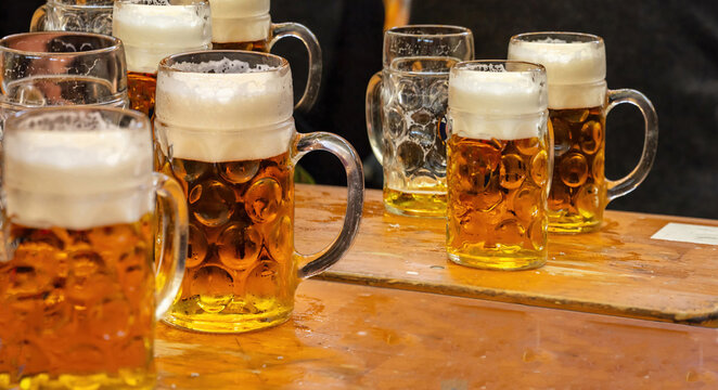 Beer mug on a table, close up. Oktoberfest, Munich. German beer festival.