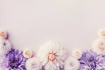 Foto op Plexiglas Beautiful dahlia flowers on pastel table with copy space for your text top view and flat style. Greeting card for birthday or mother day. © juliasudnitskaya
