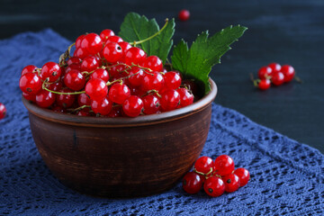 A bowl of red currants in close-up.