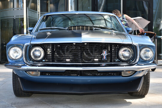 Ford Mustang Mach 1 (1969), Classic Blue Car, Front View On Grill With Fans. Free Autoshow 