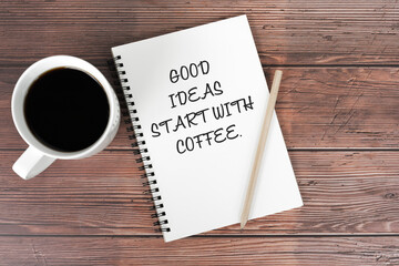 Cup of coffee and note pad with inspirational text - Good ideas start with coffee
