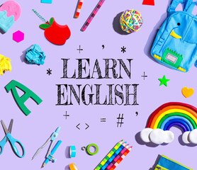 Learn English theme with school supplies on a purple background