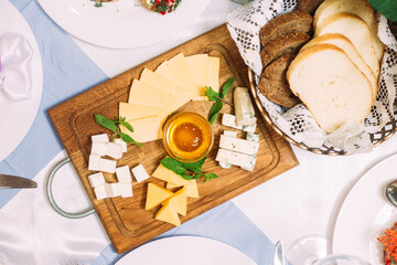Cheese plate with honey. Cheese appetizer