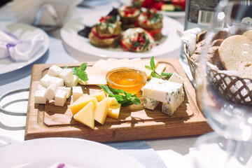 Cheese plate with honey. Cheese appetizer
