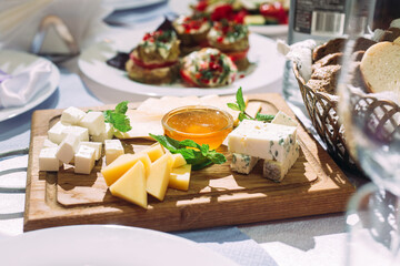 Cheese plate with honey. Cheese appetizer