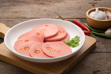 Spicy Sliced Bologna sausage with Chili in white plate © Kritchai