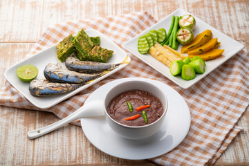 Spicy Shrimp Paste Dip (Nam Prik Kapi) served with Fried Egg with Climbing Wattle, fried mackerel fish and boiled vegetable