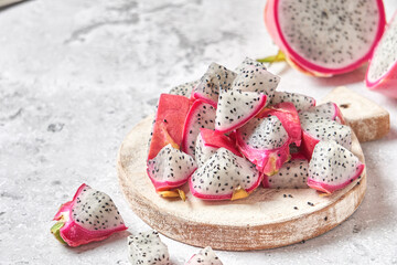fruit with medicinal properties. Pitahaya dragon fruit on a wooden board.